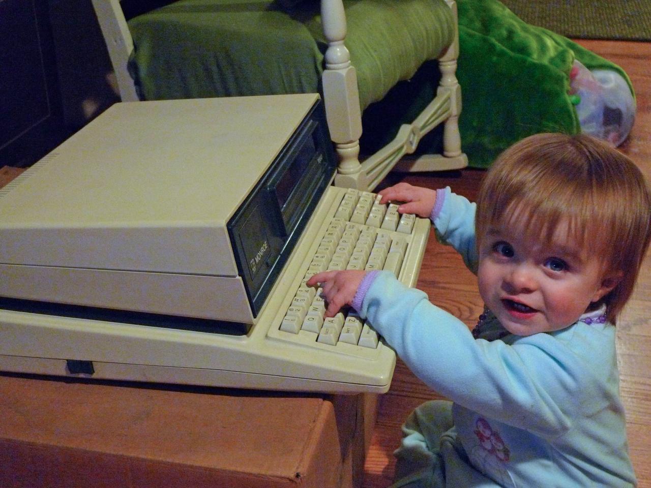 Toddler using old word processor
