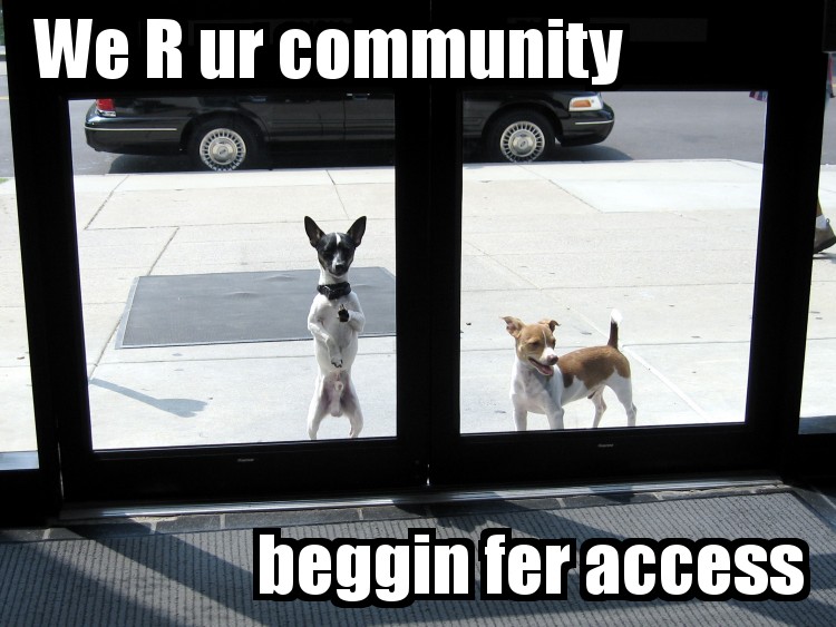 Dogs outside door, captioned 'We R UR community, beggin fer access'