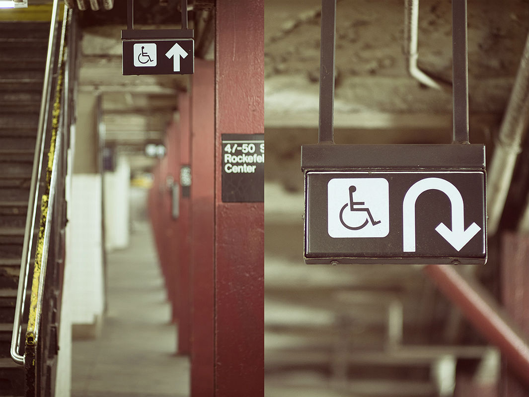 Signs pointing to handicap-accessible routes