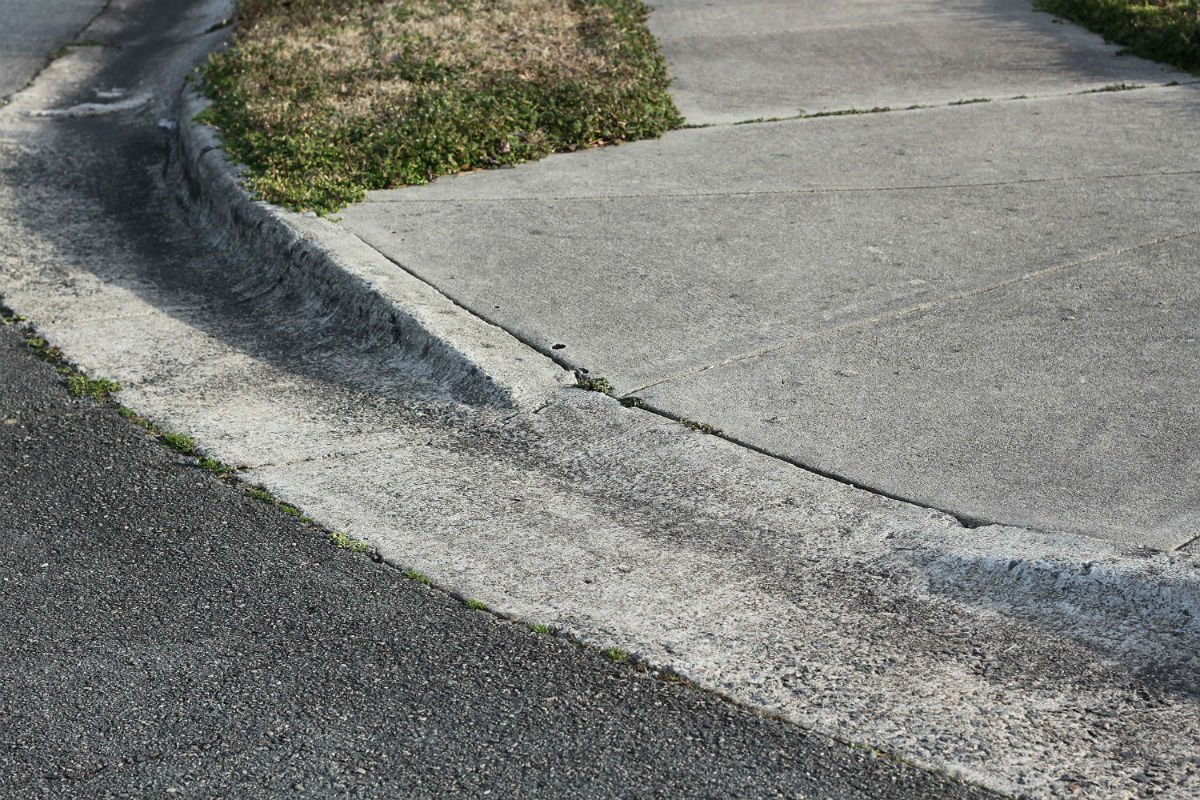 Curb cut on sidewalk