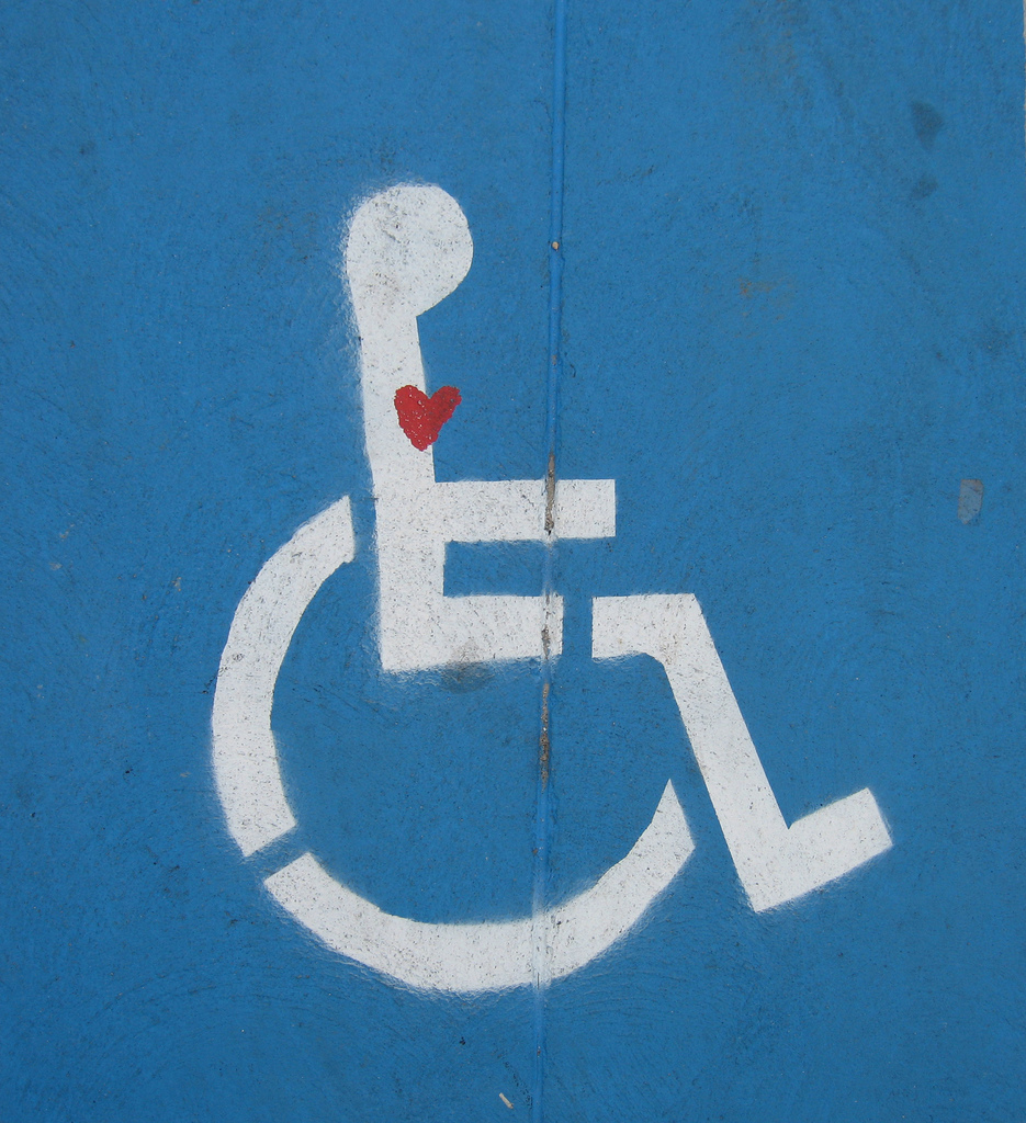 Disabled parking symbol with a heart